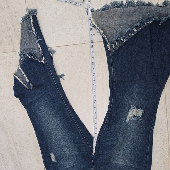 These trendy flare denim jeans feature a bold, boho-chic look with distressed de - Picture 5 of 10
